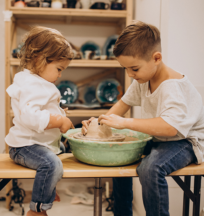 Home brothers at a pottery class together